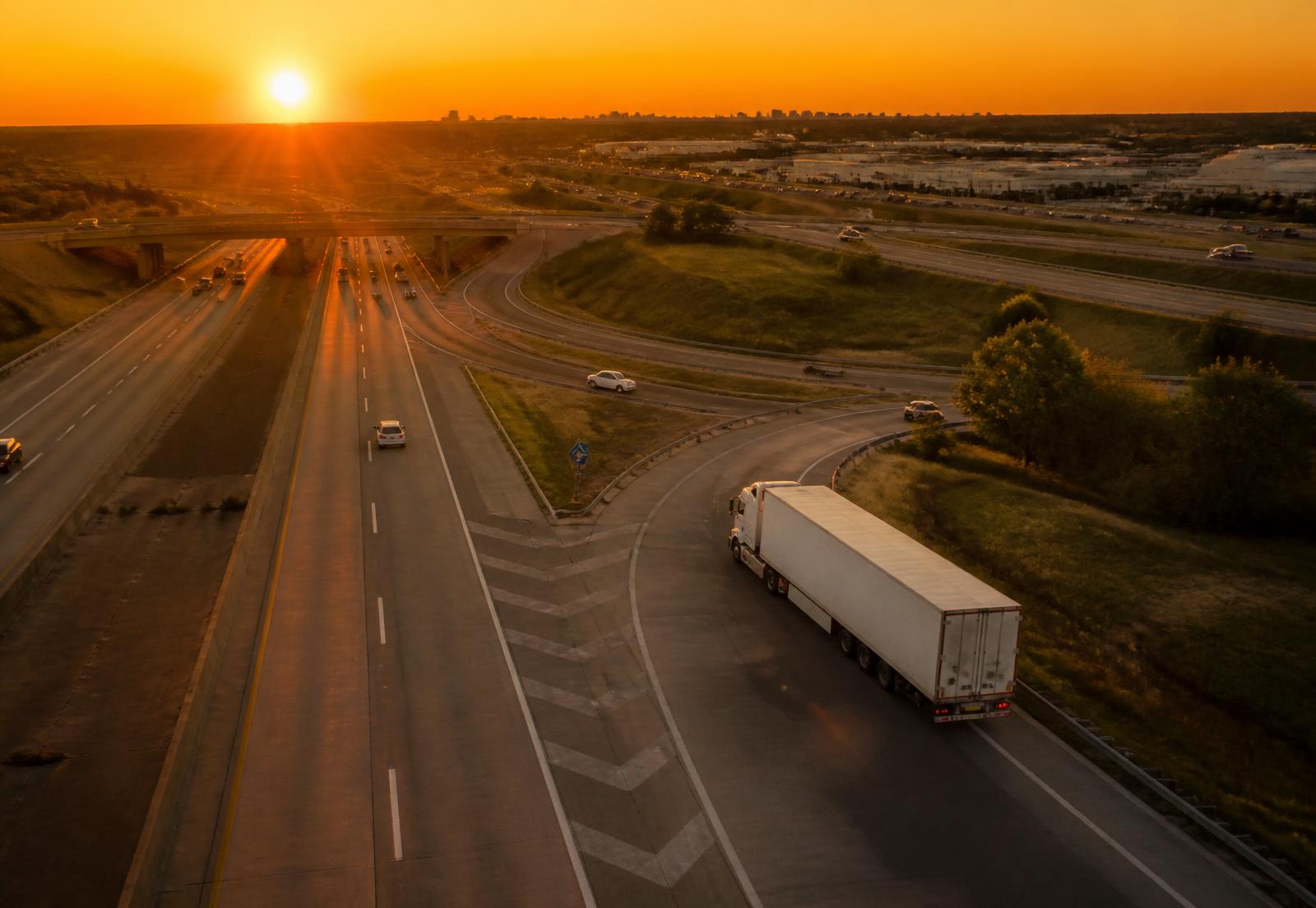 American semi truck merging onto a US interstate interchange